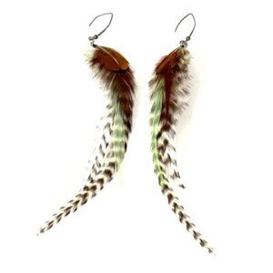 Natural feather statement earrings.